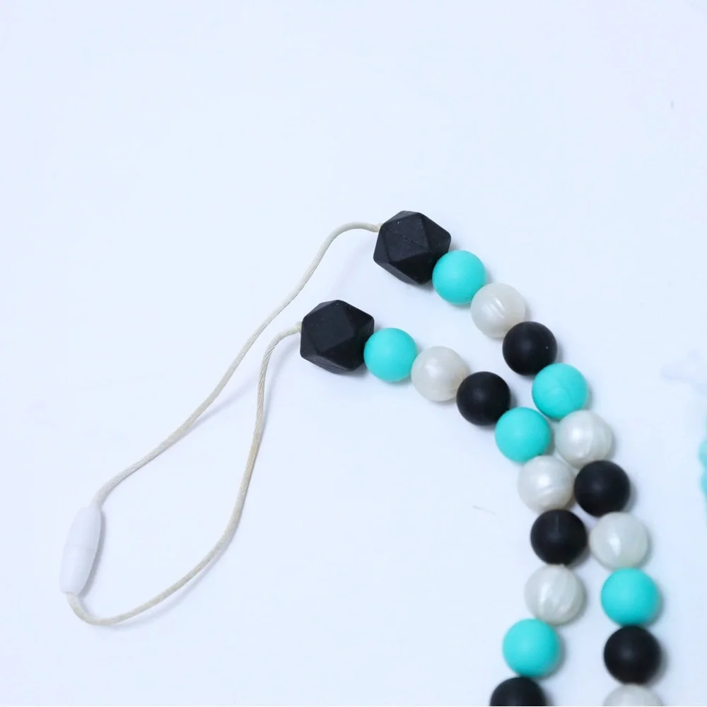 Set of crocheted baby shoes and teal baby teething necklace chewy shower newborn